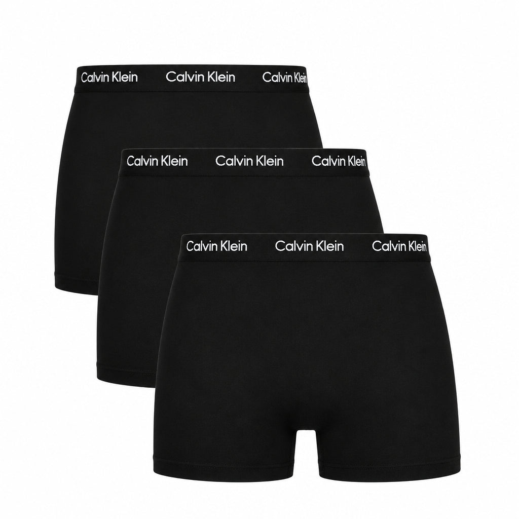 Three pairs of black Calvin Klein boxer briefs on a white background