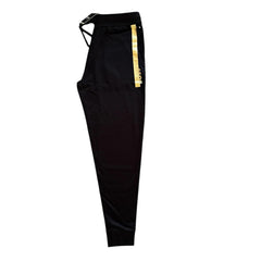 Black athletic jogger pants with a gold and black vertical stripe detail on the side, displayed against a solid white background.