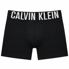 Black Calvin Klein men's boxer briefs displayed on a mannequin torso, featuring the brand name in white capital letters on the elastic waistband.