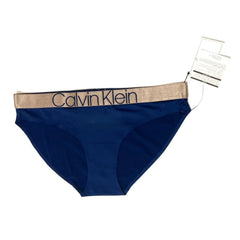 Navy Calvin Klein underwear with beige waistband on a white background