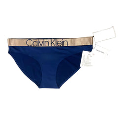 Blue Calvin Klein underwear with gold waistband on a white background