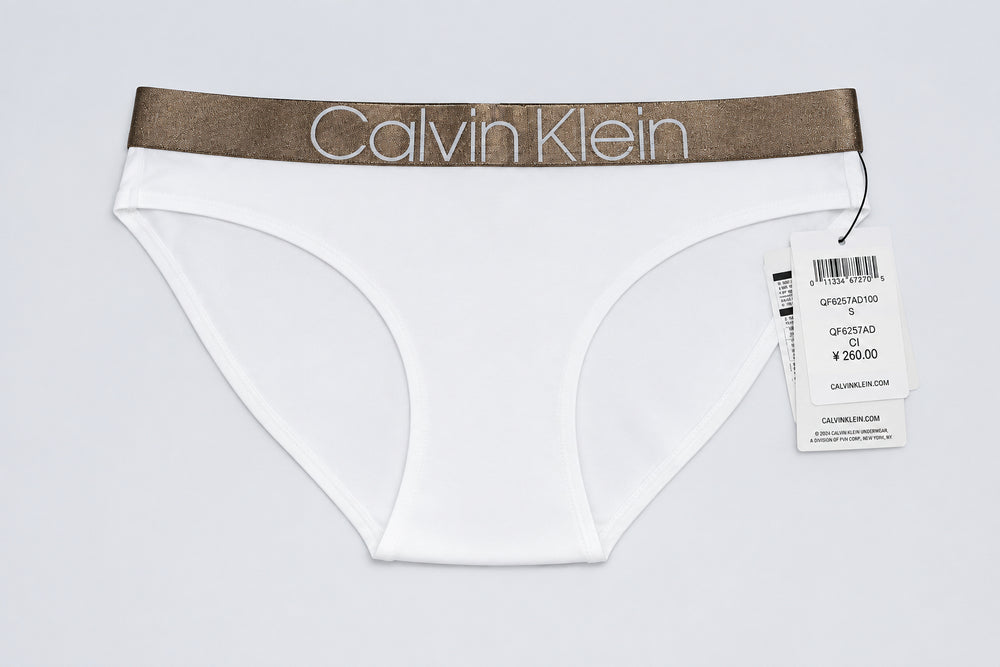 White Calvin Klein underwear with a brown waistband on a white background