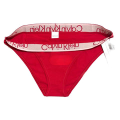 Red Calvin Klein men's underwear with brand logo on waistband against a white background