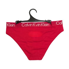 Red Calvin Klein underwear on a hanger with visible branding.