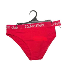Red Calvin Klein underwear on a hanger with a white background