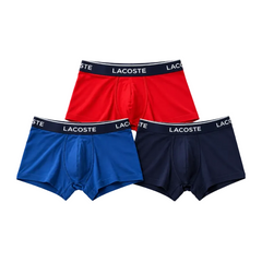 Three pairs of Lacoste men's boxer briefs in red, blue, and navy, arranged in a triangular stack against a plain white background.