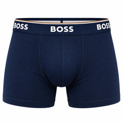 A pair of navy blue BOSS men's boxer briefs with a white BOSS logo printed on the waistband, shown against a plain white background.