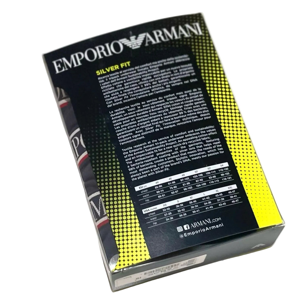 A boxed garment package photographed on a white background, showing the back panel with the brand name EMPORIO ARMANI, the text SILVER FIT, dense product information in Italian, a size chart, and a yellow-to-black halftone gradient design.
