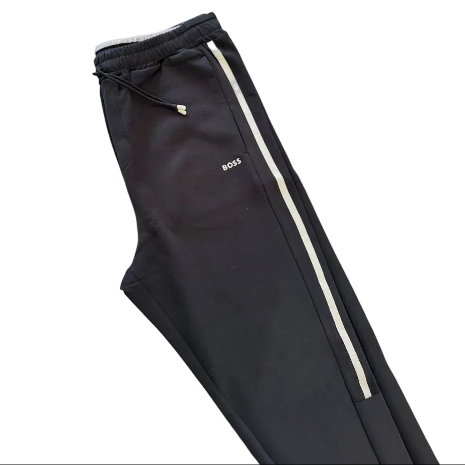 Black Boss tracksuit bottom with white side stripe and logo on the pocket.