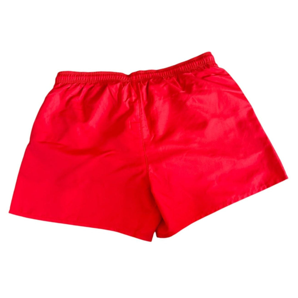 Bright red athletic shorts with an elastic waistband, shown flat against a plain white background.