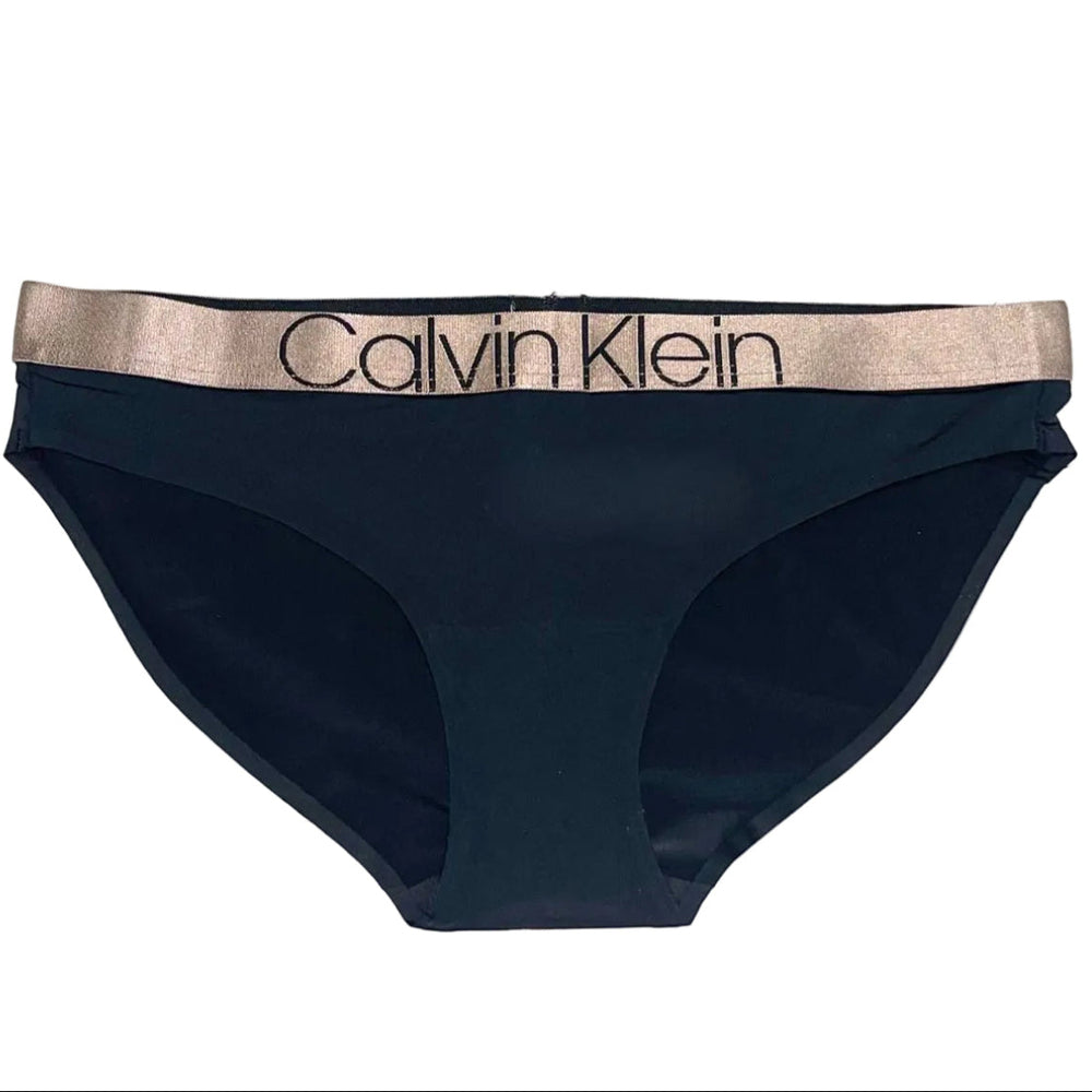 Black Calvin Klein underwear with gold waistband on a white background