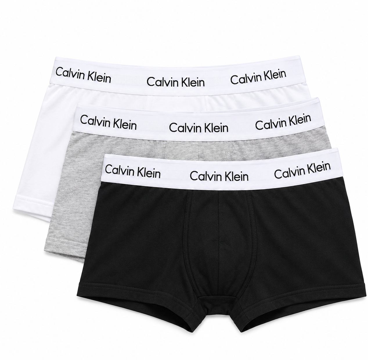 Three pairs of Calvin Klein boxer briefs stacked in a fan arrangement on a white background, featuring black, light gray, and white fabrics with white elastic waistbands printed with the Calvin Klein brand name.