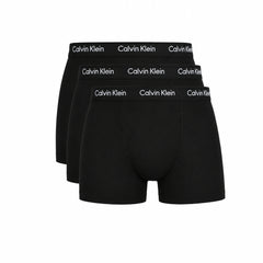 Three pairs of black Calvin Klein boxer briefs arranged in a fan shape against a white background.