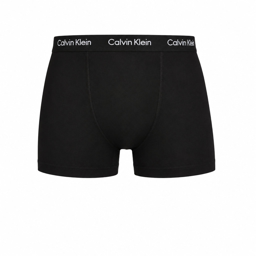 Black drawstring shorts with a small tonal logo on the left thigh and a visible 'ESSENTIALS' logo on the right leg, shown against a plain white background.