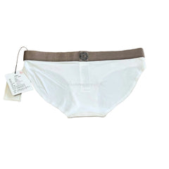 White women's briefs with a brown elastic waistband, laid flat on a wood-grain surface with a product tag attached.