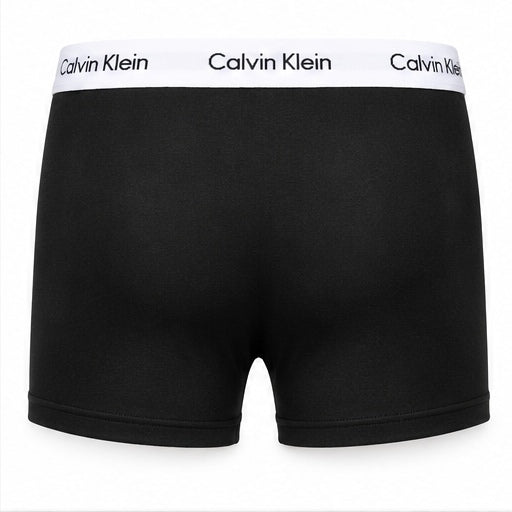 Black Calvin Klein boxer briefs with a white waistband featuring the brand name 'Calvin Klein' printed in black.