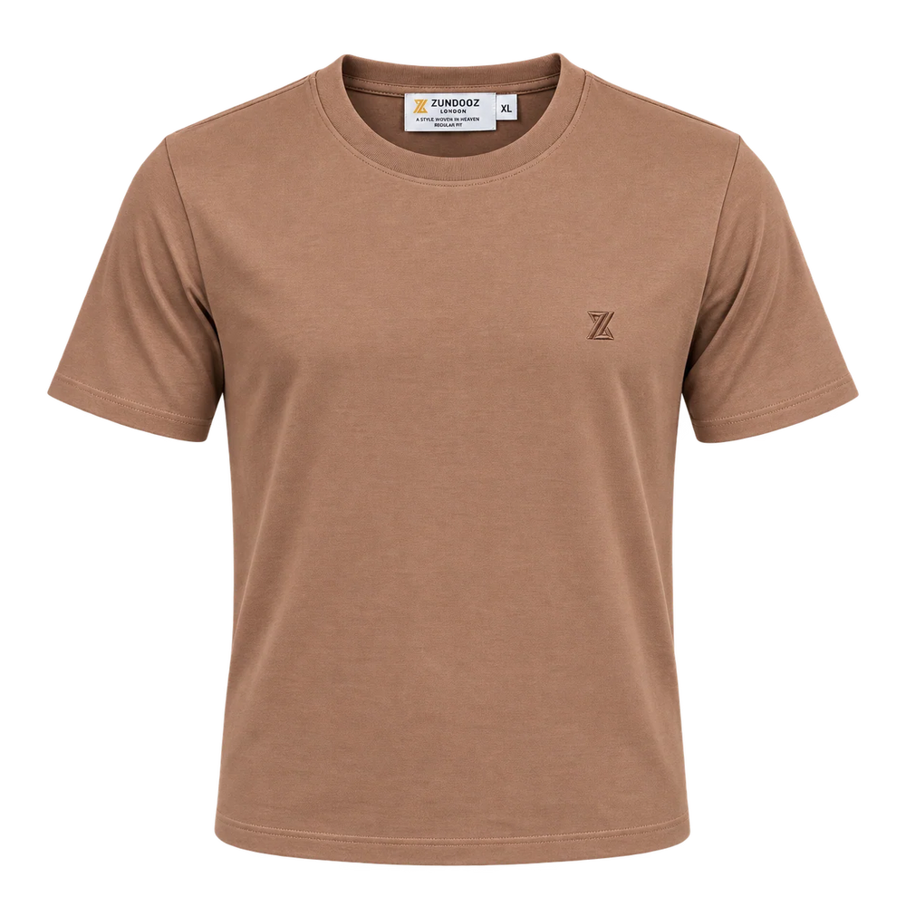 A short-sleeve crewneck t-shirt in a warm tan or camel brown color, featuring a small dark embroidered 'Z' logo on the left chest. The brand name 'ZUNDOOZ' is visible on the inner neck label.
